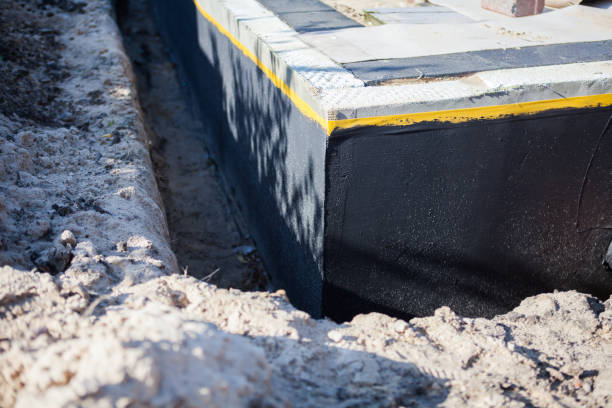 Professional Waterproofing technician working in Pine Village, IN